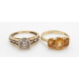 A 9ct gold ring set with topaz and a 9ct gold ring set with cubic zirconia, 5.7g