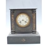 Oak aneroid barometer and a black slate mantel clock with Smith, Cranbrook, Kent to Roman dial,