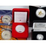 Five Australian silver coins comprising a proof centenary dollar, a 2002 1oz Lunar proof coin, a