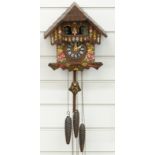 German three train cuckoo clock with musical automaton dancers feature on the hour and half hour,