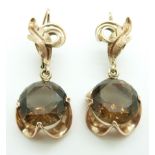 A pair of rose gold earrings set with smoky quartz, 10.3g