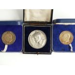 Three cased 20thC silver medal coins, one for George V and Queen Mary, and two for Edward Duke of