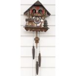 German c1980's musical two train cuckoo clock with automaton feature dancers and water wheel on