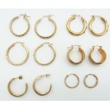Five pairs of 9ct gold hoop earrings (8.6g) and a pair of 14k gold earrings (4g)