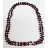 A two strand Victorian garnet necklace with a foiled garnet clasp