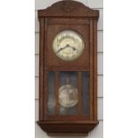 Oak wall clock with two train movement, 59cm tall