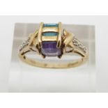 A 9ct gold ring set with an amethyst and blue topaz, 3g, size O