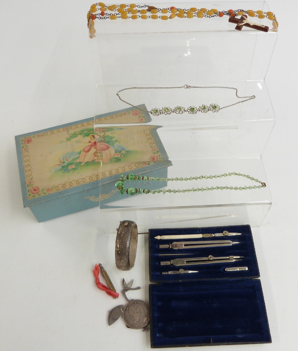 1869 five Franc with fold-out etui - scissors, knives etc, Art Deco beads, silver bangle, pencil,