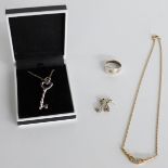 A silver key necklace marked Tiffany, a pair of silver earrings, a silver ring and a necklace