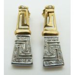 A pair of bi-coloured 14ct gold earrings set with diamonds in a Greek key design, 7.9g