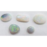 Four oval opal cabochons and a rectangular opal cabochon, largest 11.5 x 5.6 x 3mm and smallest 6.