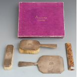 Asprey Art Deco hallmarked silver gilt four piece dressing table set comprising hand mirror, two