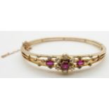 Edwardian 15ct gold bangle set with three rubies measuring approximately 1.2 ct, 0.2 & 0.2ct and old