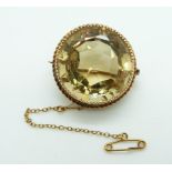 Victorian gold brooch set with a large round cut citrine within a rope twist border, 18.5g, diameter
