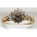 A 9ct gold ring set with diamonds in a cluster, 2.4g, size O