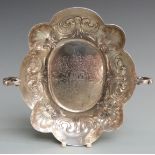 German 18th century twin handled bowl of lobed design with coat of arms and bearing date 1683 to