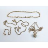 A 9ct gold bracelet, two yellow metal chains (7.9g) and a Victorian charm