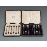 Two cased sets of hallmarked silver tea or coffee spoons, one set with sugar tongs London 1918 in