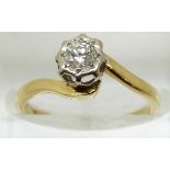 An 18ct gold ring set with a diamond of approximately 0.2ct in a platinum setting, 2.7g, size J