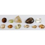 Five oval cut citrine, emerald cut citrine, cushion cut citrine, a round cut smoky quartz, an oval