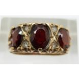 A 9ct gold ring set with garnets, 3.7g, size K