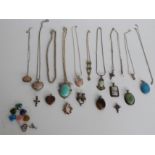 A collection of silver pendants including Art Nouveau style, jadeite style, amethyst etc