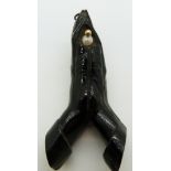 A large black coral pendant in the form of two hands praying, found in the Solomon Islands, 7cm