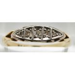 An 18ct gold ring set with five diamonds in a boat shaped platinum setting, 2.5g, size M