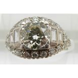 Art Deco ring set with a central diamond of approximately 1.5ct flanked by two baguette cut diamonds