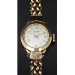 Timor 9ct gold ladies wristwatch with gold hands and Arabic numerals, silver dial and signed 17