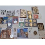 A collection of modern commemorative crowns, coin first day covers etc, includes 1935 'rocking