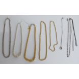 Three silver gilt necklaces and four silver necklaces etc