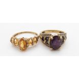 A 9ct gold ring set with topaz and a 9ct gold ring set with amethysts, 7.3g
