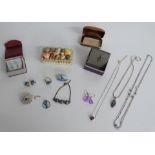 A collection of silver jewellery including labradorite necklace, amethyst necklace, necklace set