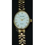 Accurist 9ct gold ladies wristwatch with gold hands and Roman numerals, white enamel dial and quartz