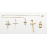 Three 9ct gold cross pendants, two 9ct gold chains (5g) and a 14k gold cross pendant set with