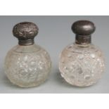 Two hallmarked silver lidded hobnail cut globe shaped dressing table scent or similar bottles, one