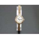 Omega 9ct gold ladies wristwatch ref. 611.622 with blued hands, black Arabic numerals, silver
