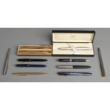A collection of pens including two Parker Slimfold, Waterman's marbled blue 513, boxed Cross