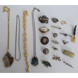 A collection of jewellery including Victorian silver brooches, Victorian brooch set with mother of