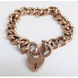 A 9ct rose gold curb link bracelet with heart padlock, 30.6g