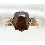 An 18ct gold ring set with a cushion cut smoky quartz and two diamonds, 4g, size P
