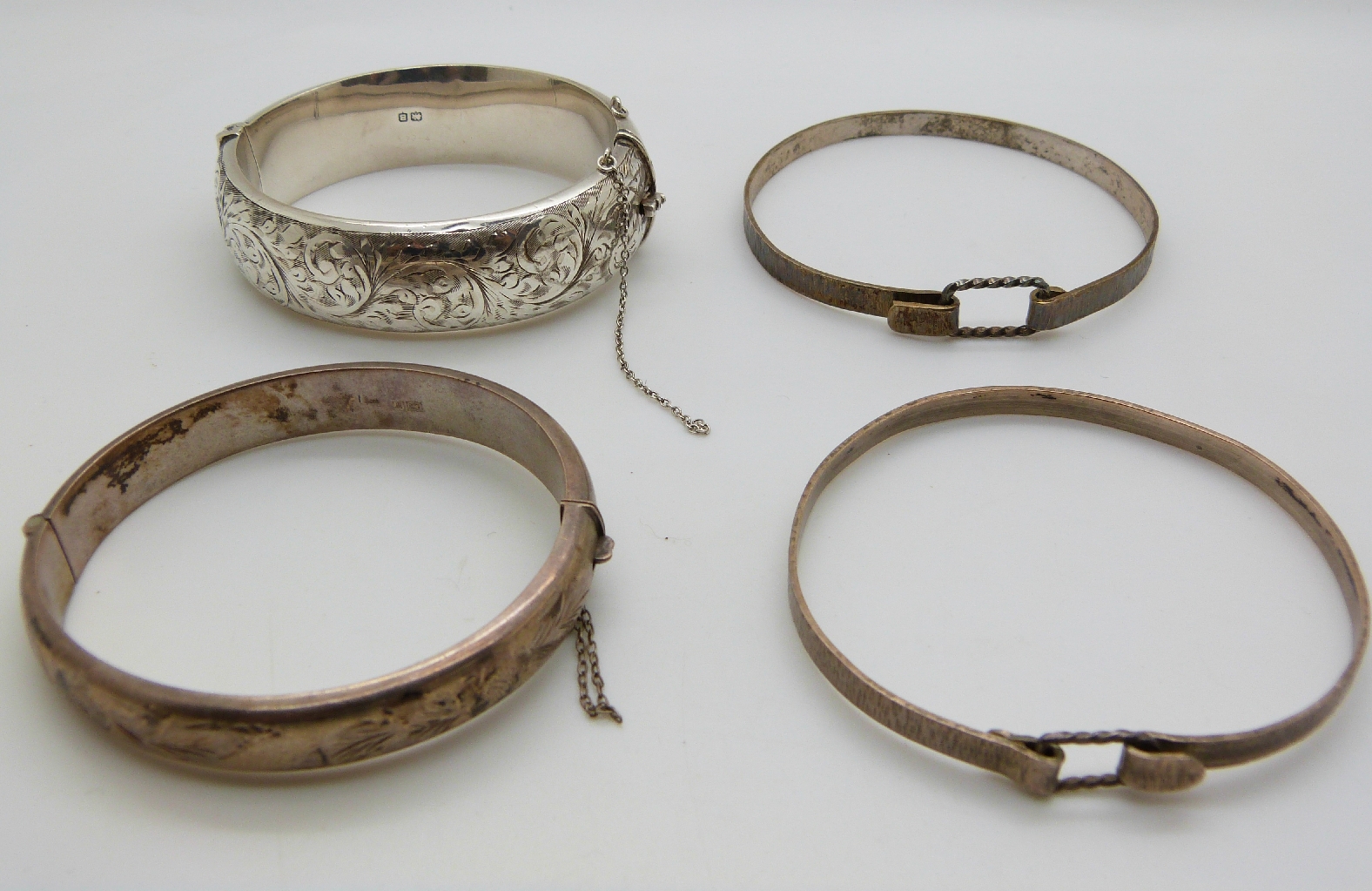 Four silver bangles