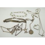 A collection of silver including a pendant, identity bracelet and necklaces including bespoke silver