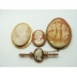 A 9ct gold pendant/brooch set with a cameo, two other cameos and a 9ct gold bar brooch set with a