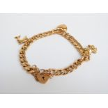 A 9ct gold charm bracelet, 12.1g