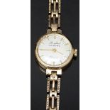 Bruford of Eastbourne 9ct gold ladies wristwatch with gold hands and baton markers, silver dial
