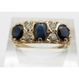 A 9ct gold ring set with three oval sapphires and diamonds, 3.5g, size R