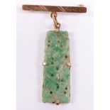 An 18ct gold brooch set with a jadeite plaque, 3.5cm long