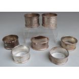 Seven various hallmarked silver napkin rings, weight 122g